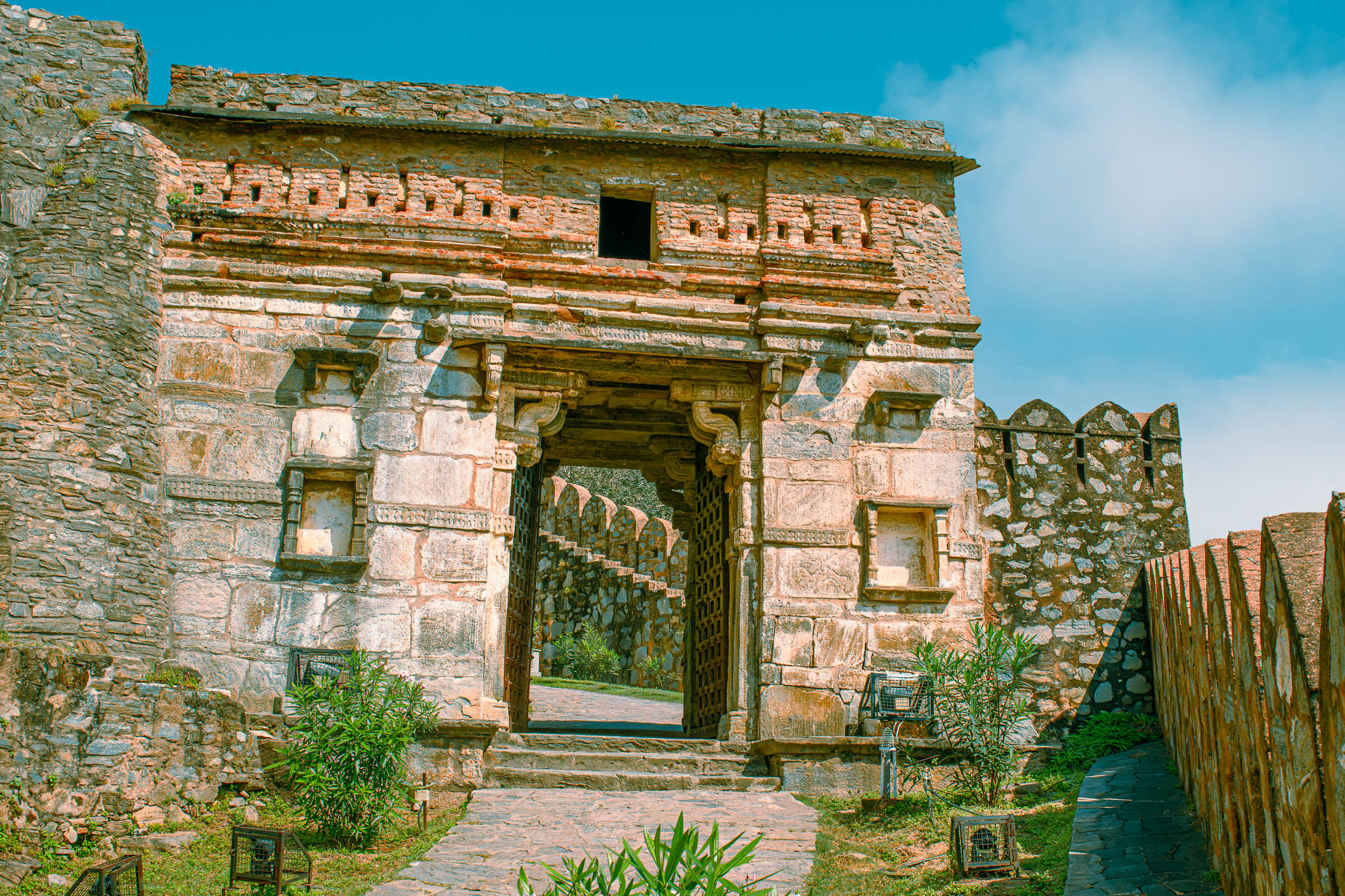 Main gate of Kumbhalgarh Fort photographed from below to emphasize scale and texture.