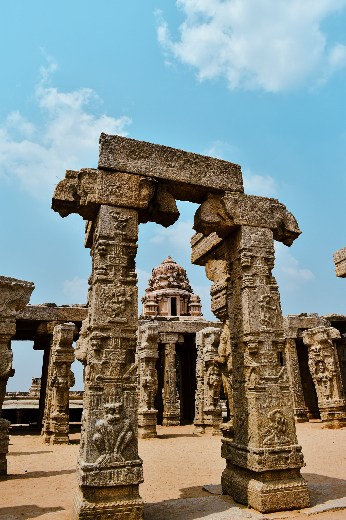 Carved pillars at Lepakshi temple photographed with depth and perspective.